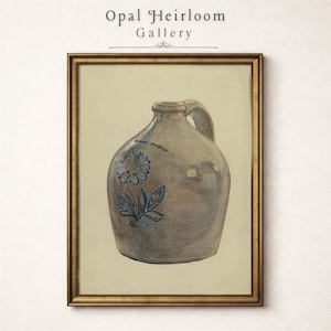 May include: A framed wall art print featuring a hand-drawn illustration of a tan stoneware jug with a single handle. The jug is decorated with a blue floral motif on the front and is enclosed in a thin, metallic gold-toned rectangular frame.