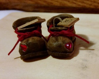 Pair of Old Boots with a red Swarovski heart inlaid in toe area.