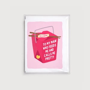 May include: A greeting card with a pink background and a red Chinese takeout box illustration. The box has the text "TO MY MAN WHO FEEDS ME AND CALLS ME PRETTY" and a label that reads "HE'S A KEEPER."