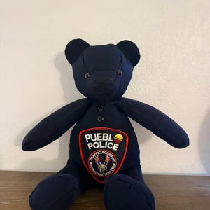 Första hjälpande uniform minnesbjörn, polisens minnesdjur