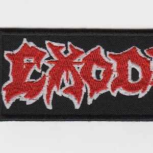May include: A rectangular embroidered patch with a black background and a red border. The word EXODUS is stitched in a jagged, stylized red font with a thin white outline, centered horizontally on the patch against the black fabric base.