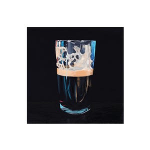 May include: A tall glass filled with a dark liquid, topped with a creamy, off-white foam. The glass has a clear, slightly blue tint, and the background is a solid black. The image is a close-up of the glass, highlighting the texture of the foam.