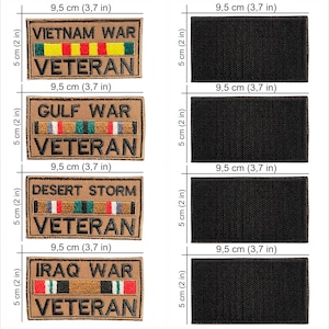 May include: Tan embroidered patches with text and ribbons, 3.7 inches wide and 2 inches tall. Patches read "VIETNAM WAR VETERAN", "GULF WAR VETERAN", "DESERT STORM VETERAN", and "IRAQ WAR VETERAN". Also included are four black patches of the same size.