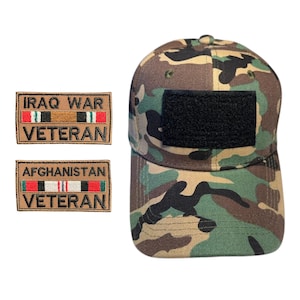May include: Camouflage baseball cap with a black square patch and two patches that read "IRAQ WAR VETERAN" and "AFGHANISTAN VETERAN". The cap features a woodland camouflage pattern in shades of green, brown, and black.
