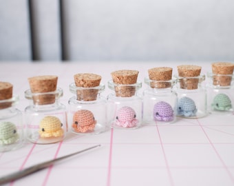Miniature crochet octopus in a 2 cm glass jar
