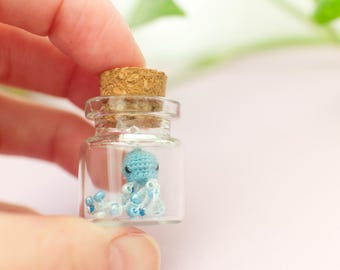 Micro crochet jellyfish in a 2 cm glass jar - blue with beaded tentacles