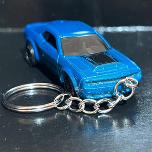 May include: A set of three ceramic vases in varying heights. The vases are white with a textured, ribbed design. The tallest vase is approximately 10 inches tall, the medium vase is 8 inches, and the smallest is 6 inches.