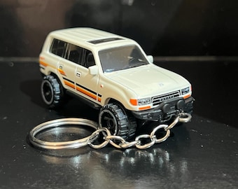 Varios llaveros Toyota Land Cruiser Serie 80 FJ60 4x4, coche de metal fundido a escala 1:64, llavero, camioneta pickup / mini regalo