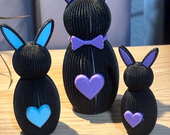 Archivo STL 3D: Familia de conejos de estilo escandinavo. Decoración de Pascua moderna con corazón y pajarita. Descarga digital para impresión 3D.
