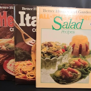 May include: Three vintage cookbooks with titles including "Meat," "Italian," and "Salad Recipes." The "Salad Recipes" book features a cover image of various salad dishes. The books are from the "Better Homes and Gardens" series.