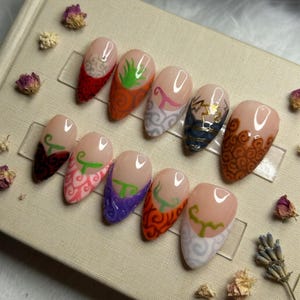 May include: A white ceramic mug with a black handle and the text "But First, Coffee" in a black, handwritten-style font. The mug is on a white surface.