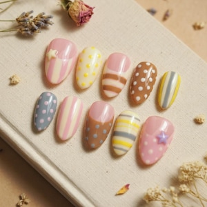 May include: A set of three ceramic mugs with a speckled, matte finish. The mugs are in shades of cream, light gray, and dark gray. Each mug has a simple, minimalist design, perfect for coffee or tea.