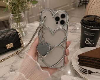 Verzilverd telefoonhoesje met hartspiegel en armband (iPhone 11-16 Pro Max)