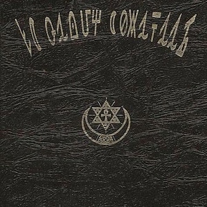 May include: Black book cover with embossed text and symbols. The top text reads "LA GLOUF COMATLAS". A central emblem features a star within a crescent moon. The bottom text is in a different script.