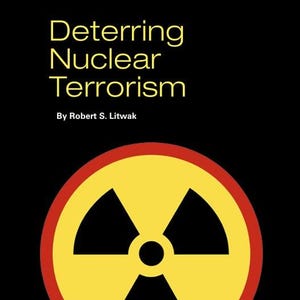 May include: A book cover with the title "Deterring Nuclear Terrorism" in yellow text on a black background. Below the title is the author's name, Robert S. Litwak. A yellow and black radiation symbol is centered, with a red border.