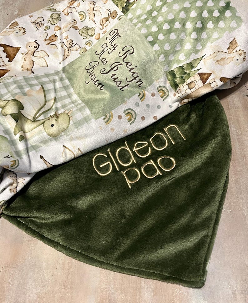 Dragon Baby Blanket: Fantasy Themed Nursery, Soft Minky Crib Comforter
Dragon minky baby blanket, shown with forest green minky. You can pick the back minky color. 
Dragon Baby Blanket Handmade Baby Quilt Fantasy Baby Nursery Bedding Baby Shower Gift Newborn Boy Room Decor Fairy Tale Crib Comforter