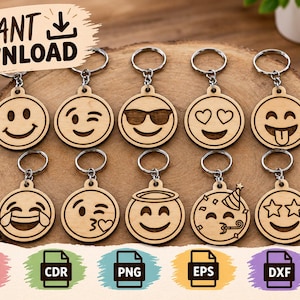 May include: Ten circular wooden keychains featuring laser-engraved emoji faces, including smiling, winking, sunglasses, heart eyes, tongue out, laughing, kissing, halo, party, and star eyes expressions, each attached to a silver metal ring.