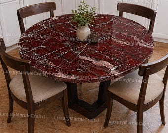 Mesa de comedor redonda de mármol rojo de lujo con tablero de piedra burdeos y vetas blancas naturales. Muebles de comedor modernos y llamativos.
