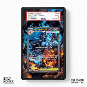 May include: A black PSA graded guard case containing a Pokemon card. The card shows a Mega Charizard X EX illustration with blue and orange flames. The case has a label with example information.