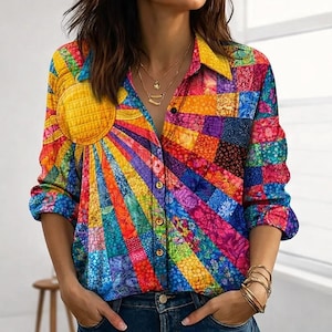 May include: A long-sleeved button-down shirt with a vibrant patchwork design. The shirt features a large yellow sun graphic on the left side, with colorful rays radiating outwards. The shirt's design incorporates various colors and patterns.
