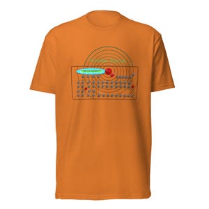 May include: An orange short-sleeved t-shirt featuring a graphic print of a radar screen overlaying a control panel with numerous knobs and buttons. The text "Vintage Digital" is printed in green above a blue oval containing the text "Full Link Available".