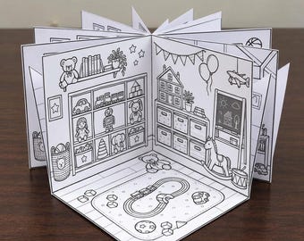 May include: A black and white accordion-style coloring book featuring a detailed illustration of a playroom. The scene includes shelves filled with toys, a rocking horse, a rug with a train track, a chalkboard, and various decorative wall elements.