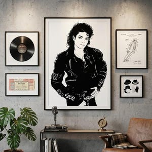 May include: A gallery wall featuring a large central black and white portrait of Michael Jackson in a leather jacket, flanked by a vinyl record, a concert ticket, a patent drawing of a dance move, and a print of a hat and glove icon set.