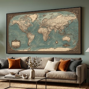 May include: A large framed world map with a vintage aesthetic. The map features a teal ocean and tan landmasses, with intricate detailing and decorative borders. The frame is dark brown, and the map is displayed above a gray sofa.