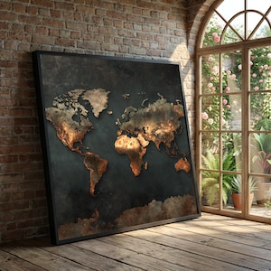 May include: A framed world map with a dark background and a textured, metallic appearance. The continents are highlighted in shades of gold and brown, creating a vintage or antique aesthetic. The map is leaning against a brick wall.