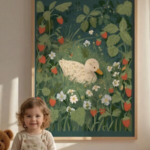 May include: A framed art print depicting a duck amidst strawberries and white flowers. The artwork has a dark green backdrop and a light wooden frame. The strawberries are red, and the duck is white with a yellow beak. The print is in a child's room.