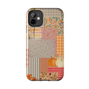 May include: A smartphone case featuring a patchwork design of various patterns including gingham, floral prints, stripes, and polka dots in autumn colors like orange, cream, and brown, with illustrations of three pumpkins in the lower right corner.