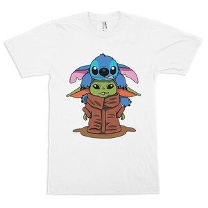 May include: A white ceramic mug with a black handle and the text "But First, Coffee" in a bold, black font. The mug is set against a blurred background. The mug appears to hold approximately 355 ml.