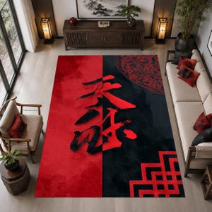 May include: A rectangular area rug featuring a split design with a solid red left side and a black right side. The rug displays large, bold red calligraphic characters in the center, a circular patterned motif, and a geometric red border design.