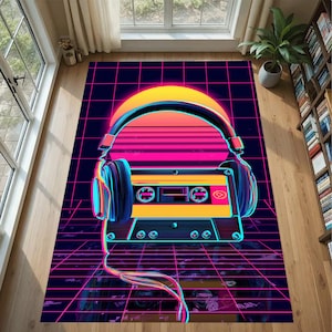 May include: A retro-style rug with a cassette tape and headphones design. The rug features a neon sunset, a grid pattern, and a dark blue background. The headphones are positioned above the cassette tape, creating a vibrant and eye-catching design.