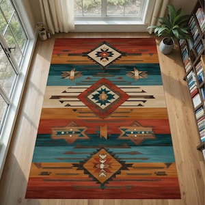 May include: A rectangular area rug with a Southwestern design. The rug features geometric patterns in shades of red, teal, tan, and brown. The design includes diamond and star-like shapes, with horizontal stripes. The rug is placed on a wooden floor.