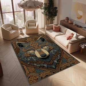 May include: A rectangular rug with a detailed wolf design. The rug features a wolf's face in shades of blue, brown, and beige, with intricate Celtic knot patterns. The rug is placed in a living room setting with neutral-toned furniture.