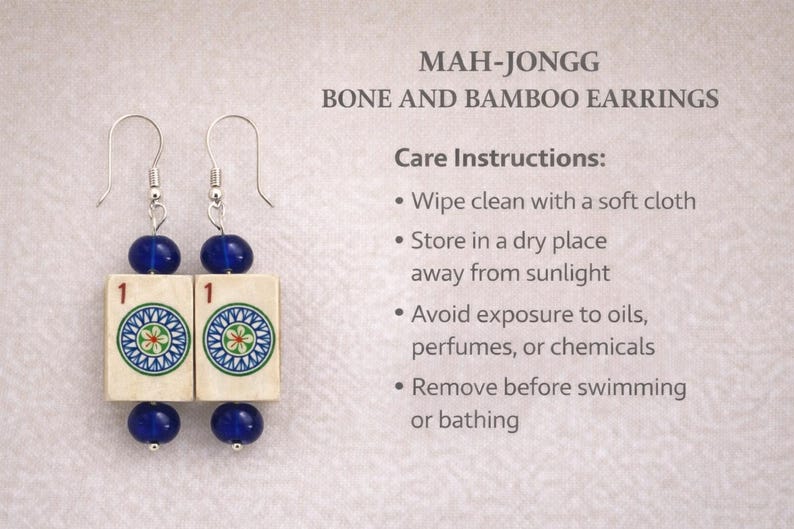 May include: Mah-Jongg earrings with bone and bamboo tiles. Each earring features a blue bead at the top and bottom, with a tile in the center displaying a colorful circular design. The text "MAH-JONGG BONE AND BAMBOO EARRINGS" is visible.