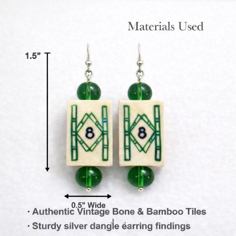 May include: A pair of dangle earrings featuring rectangular bone tiles with green bamboo designs and the number 8. The earrings are 1.5 inches long and 0.5 inches wide, with green beads and silver findings. The text says "Authentic Vintage Bone & Bamboo Tiles."