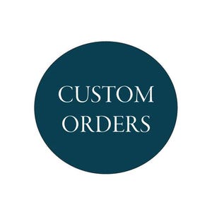 May include: A teal blue circle with the words "CUSTOM ORDERS" in white, centered within the circle. The background is plain white.