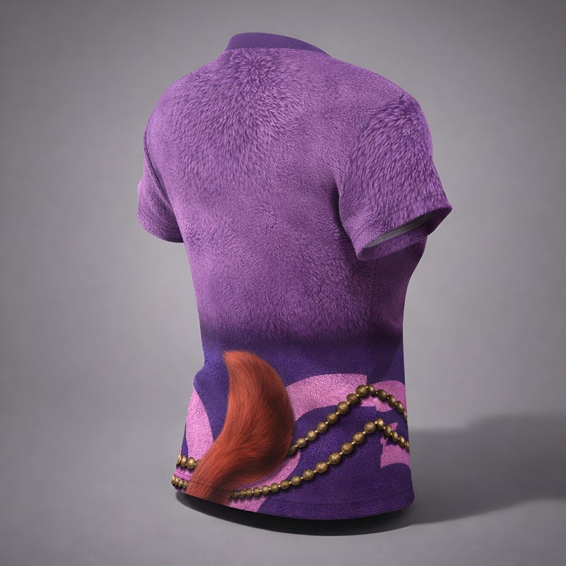 May include: A purple t-shirt with a furry texture on the upper section and a gradient design. The lower part features a stylized design with a red tail, pink accents, and a gold beaded chain. The shirt has short sleeves and a crew neck.