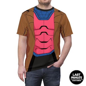 May include: A brown, pink, blue, and black graphic t-shirt featuring a costume design. The design includes a brown jacket, a pink chest piece, and a blue collar. The shirt is a costume from Last Minute Costumes.