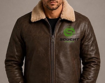 May include: A dark brown leather jacket featuring a beige faux fur collar and cuffs, a full-length front zipper, and a green logo on the chest with the text SOUGHT SPORTS printed in black lettering below the circular graphic design.