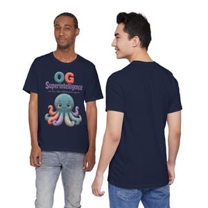 May include: A navy blue short-sleeve t-shirt featuring a graphic of a multi-colored octopus with the text "OG Superintelligence" and "Est. 300 million years ago" printed above the creature in a playful, rounded font style.