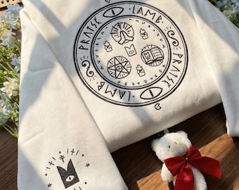 Cult of the Lamb Embroidered Hoodie, Red Crown Sleeve Detail - Gothic Gamer Sweatshirt, Indie Game Ritual Apparel.