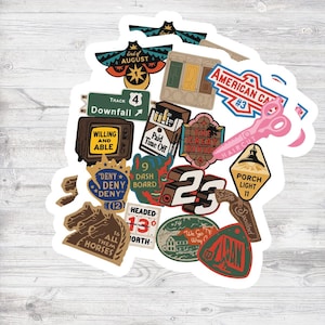 May include: A collection of assorted die-cut stickers featuring various graphic designs, including a vintage television with the text Willing and Able, a pack of cigarettes labeled Paid Time Off, a pink pair of scissors, and various road signs.