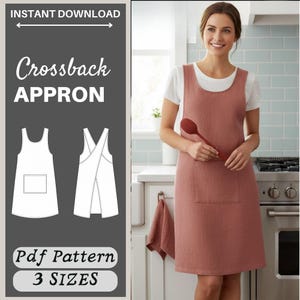 May include: A dusty rose crossback apron featuring a large front pocket and a simple scoop neckline. The image includes a digital pattern illustration with the text INSTANT DOWNLOAD, CROSSBACK APRON, Pdf Pattern, and 3 SIZES displayed clearly.