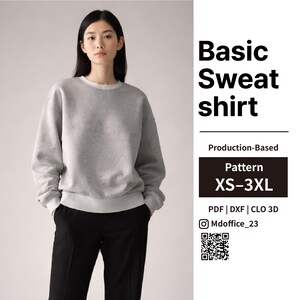 May include: A woman wearing a light gray sweatshirt with white trim and black pants. The text "Basic Sweat shirt" is displayed in large black letters. The image also includes text that says "Pattern XS-3XL".
