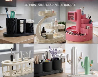 May include: A collection of 3D-printed bathroom organizers in various designs and colors. Includes a black toothbrush holder, a tiered tray, a pink makeup organizer, and a cactus-shaped jewelry holder. Text on the image reads "27+ BATHROOM ORGANIZERS STL PACK".