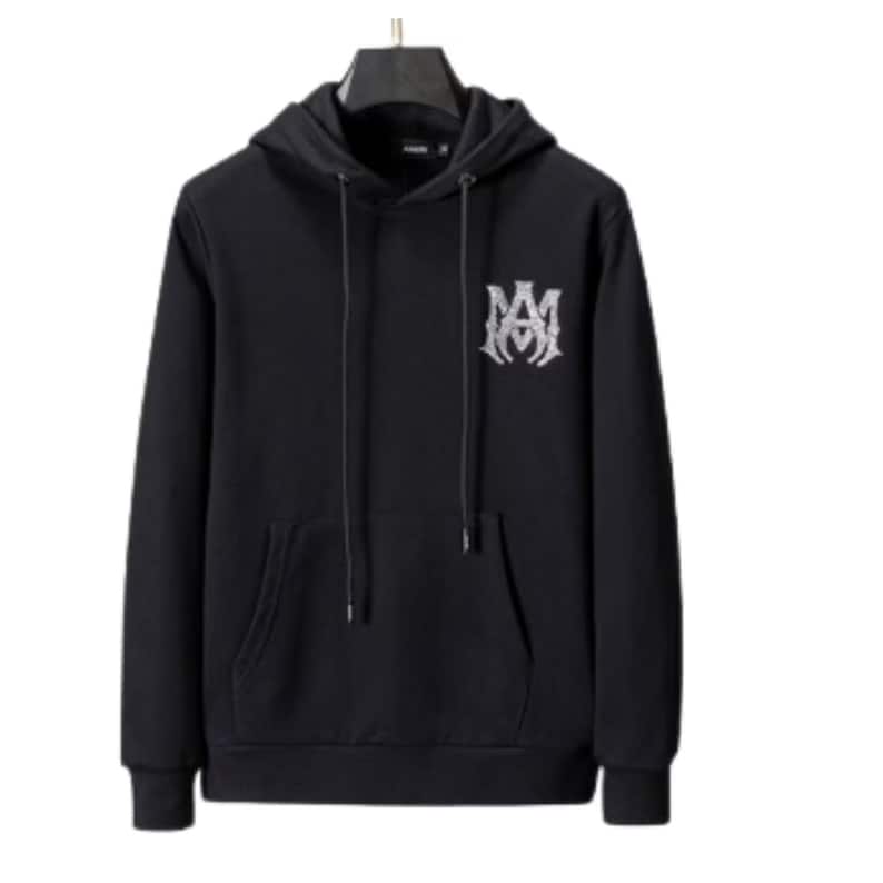 May include: Black hooded sweatshirt with a front pocket and a drawstring. The sweatshirt features a white emblem on the upper left chest. The hoodie is hanging on a black hanger.