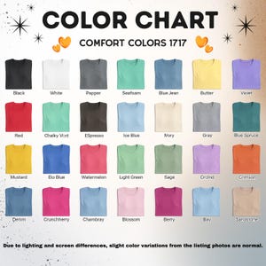 May include: Color chart showcasing a variety of Comfort Colors 1717 t-shirts. The chart displays a range of colors, including black, white, red, blue, and various shades of green, pink, and yellow. Text at the top reads "COLOR CHART" and "COMFORT COLORS 1717."
